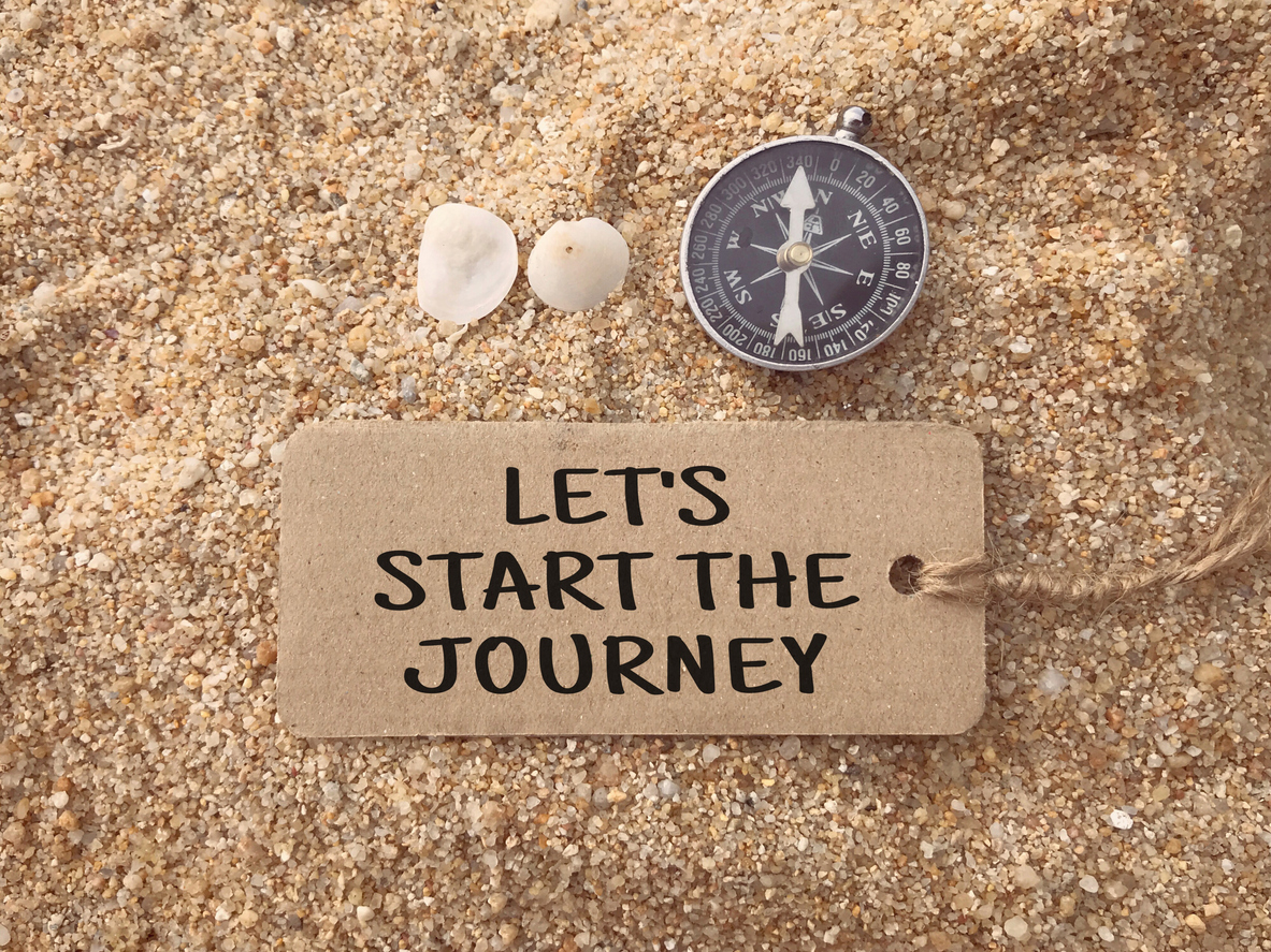 Let’s Start The Journey written on a paper tag.