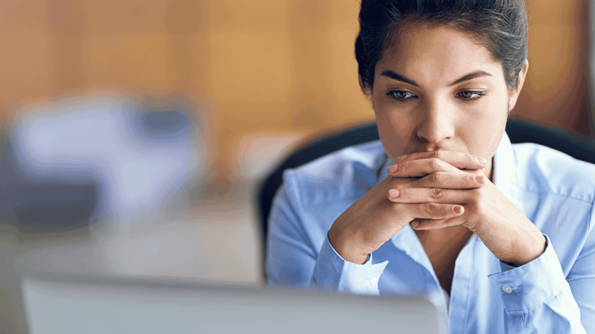 woman frowning at computer, nurse professional degree