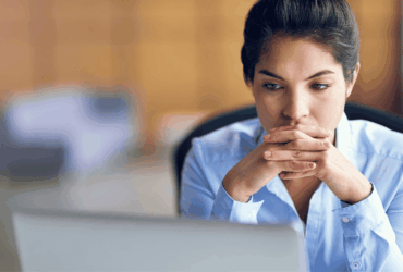 woman frowning at computer, nurse professional degree