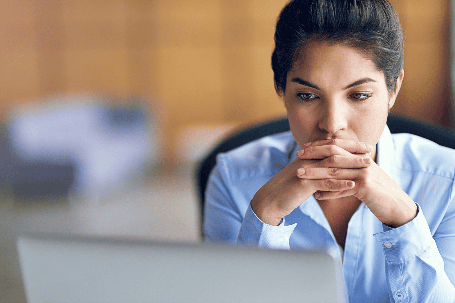 woman frowning at computer, nurse professional degree