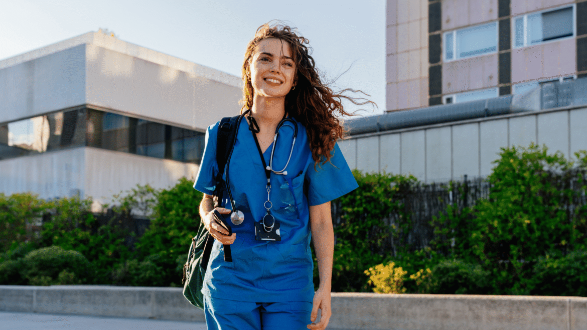 preparing for travel nursing, nurse wearing scrubs outside